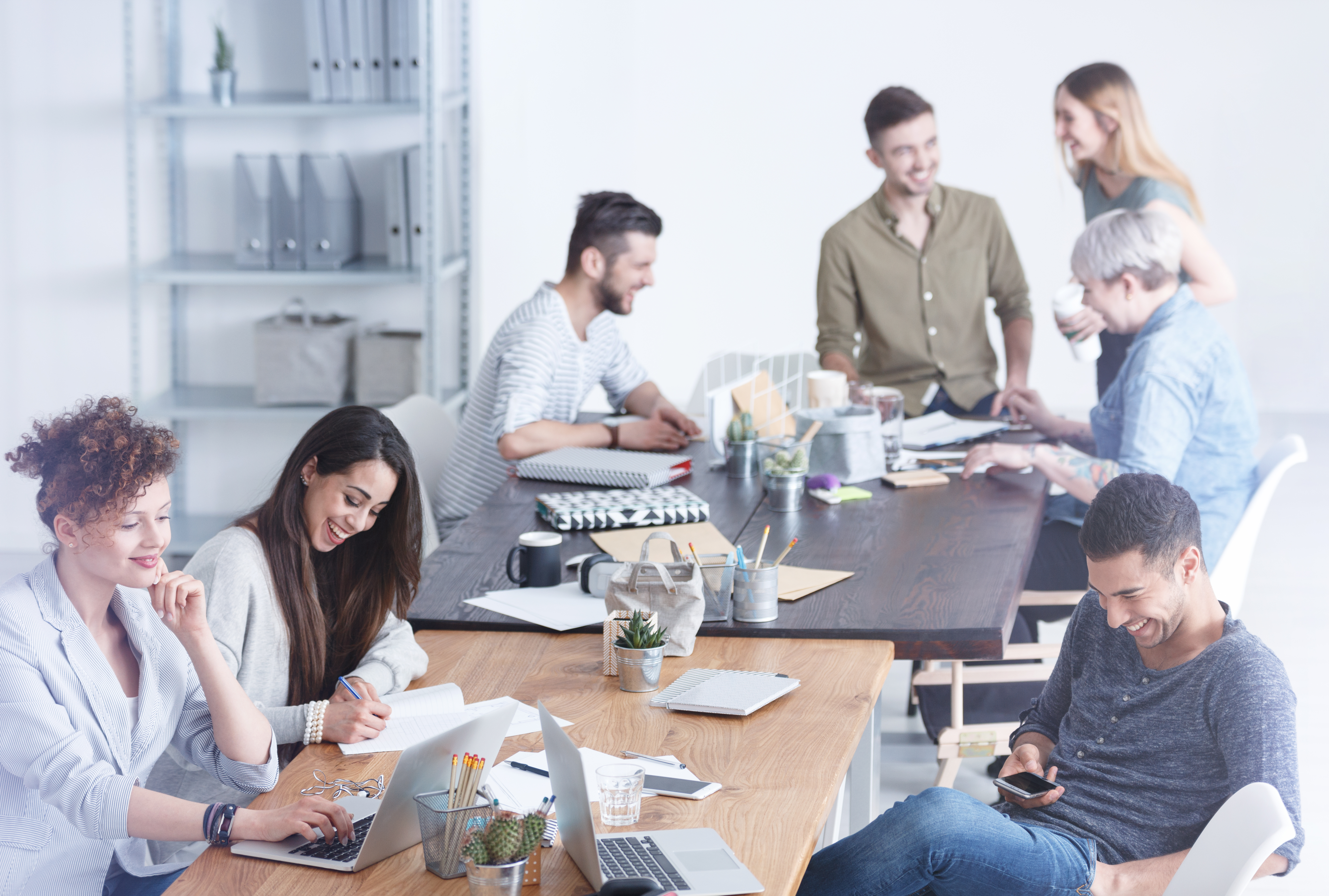 Culturally diverse team of employees enjoying their time on a break